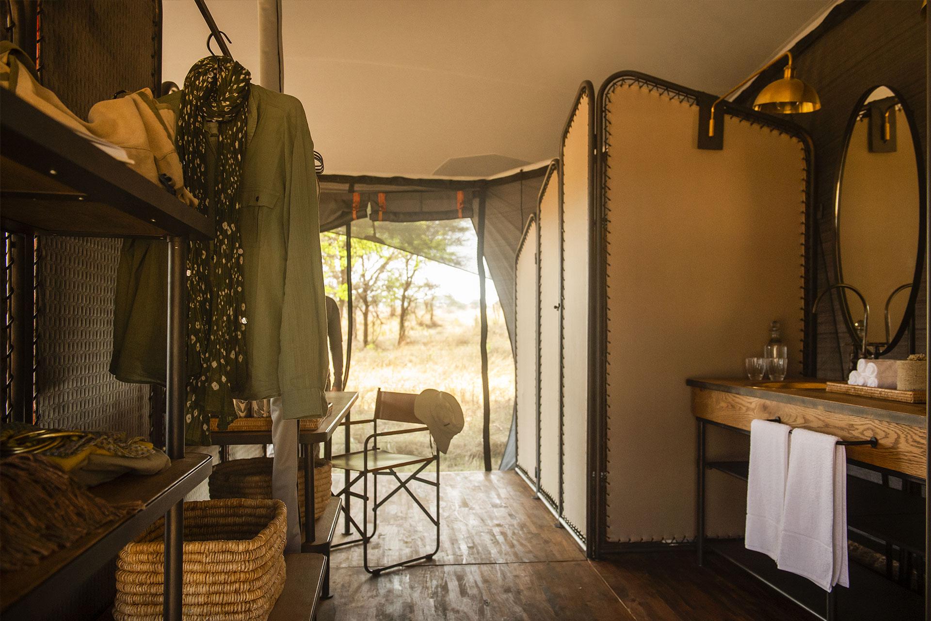 Interior of the luxury tents of the Siringit Migration Camp All canvas tents have en-suite bathrooms with double vanity, hot water on demand, and eco-friendly flush toilets
